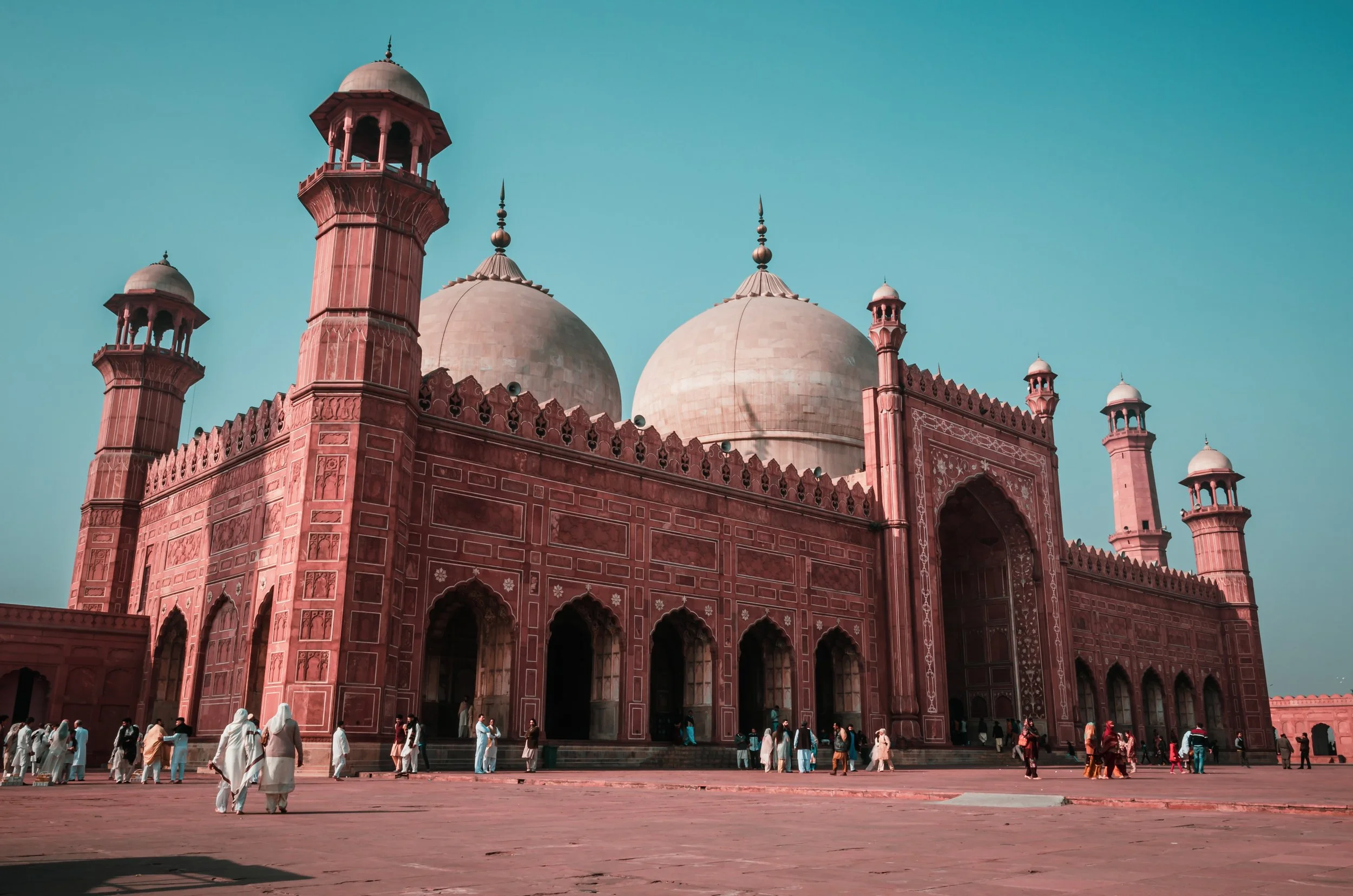 A view of the red brick mosque in Lahore,Pakistan, highlighting its architectural beauty and historical importance in the landscape.